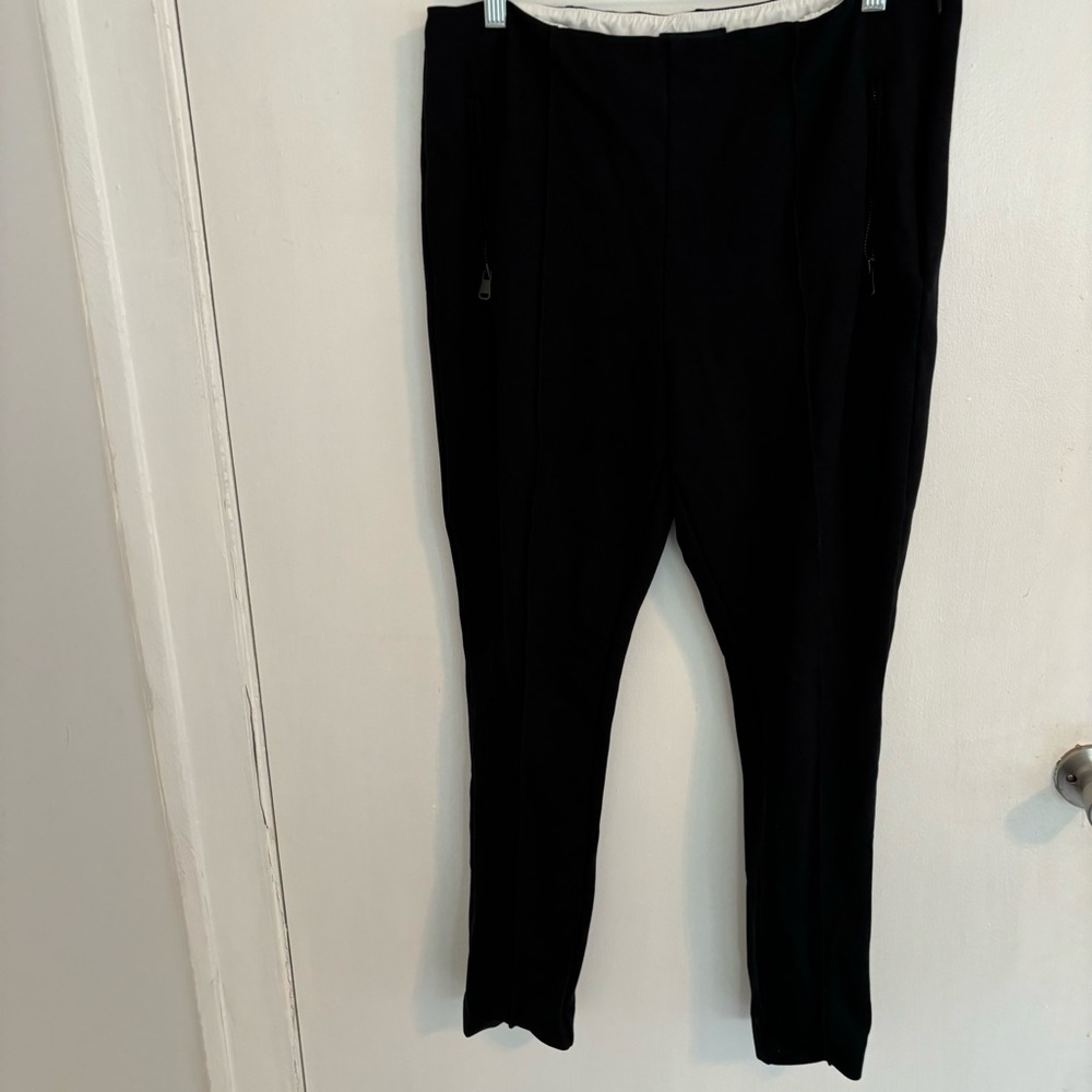 Lands End stretch black pin tuck pleat pants. Pleat is center front/back of legs